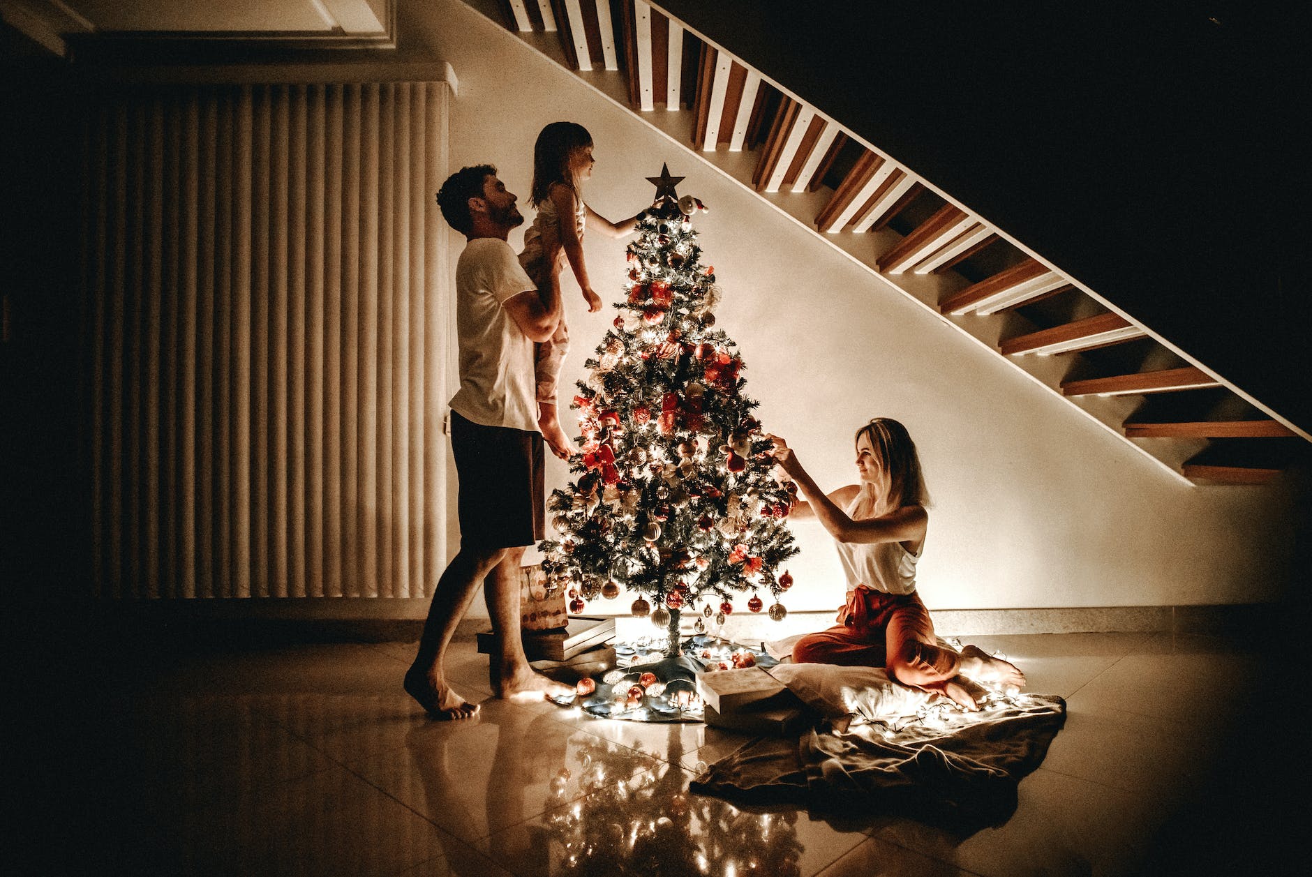 family decorating their christmas tree. staying sane this holiday season