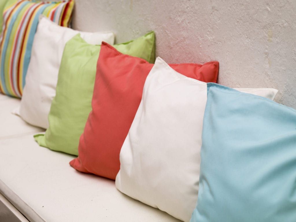 You can decorate your home on a budget by creating your own throw pillows and pillow cases