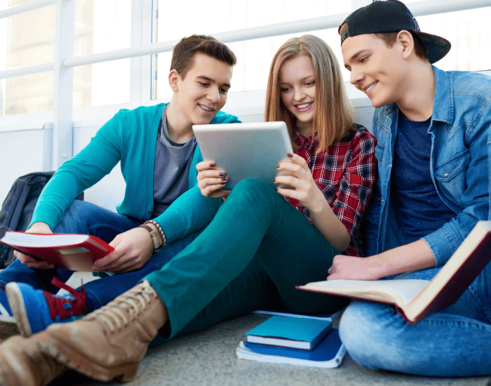 teens looking at ipad best parenting apps for education