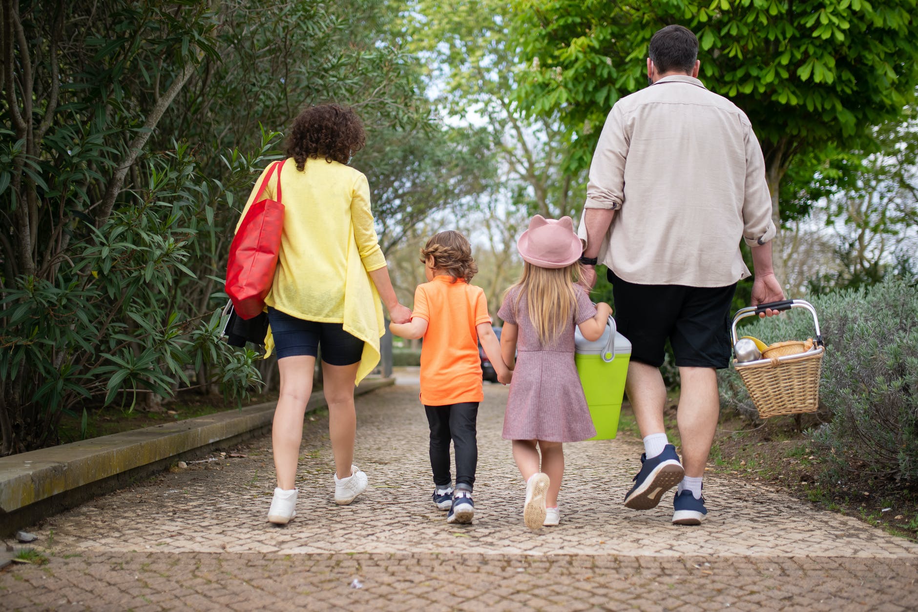 back view of a family walking together in the park