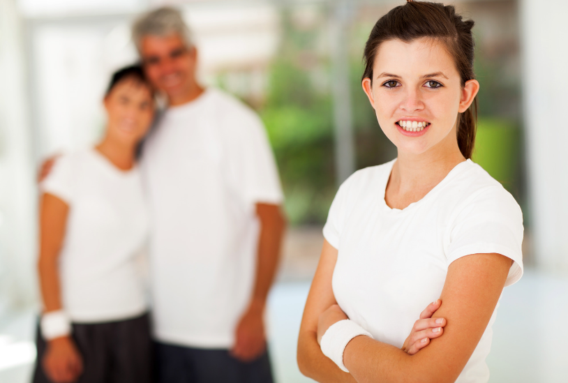 mom and dad behind smiling girl ways to give them space connect with your teen