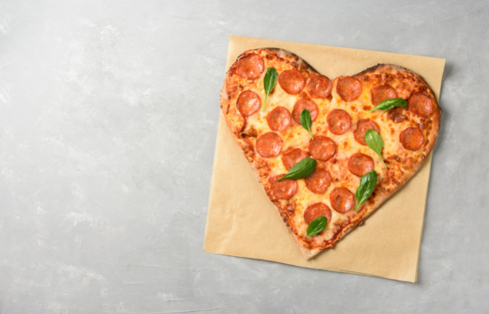 valentine themed treats for kids heart-shaped pizza with pepperoni and spinach