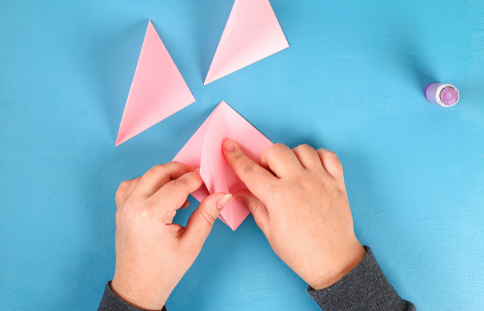 DIY Valentine's Day Cards for Kids folding paper squares in half
