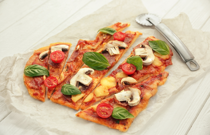 valentine themed treats for kids heart-shaped pizza with tomatoes mushrooms pineapple and spinach