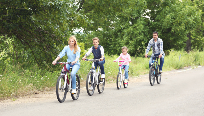 family activities for the weekend family riding bikes down a road