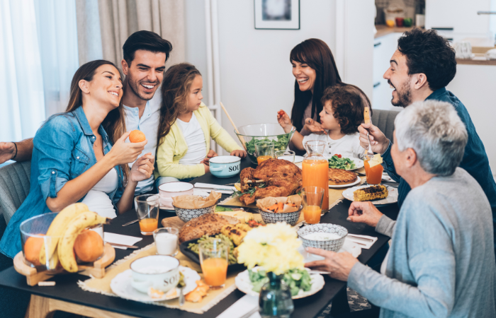 Get Back into a Routine After the Holidays family eating a meal together