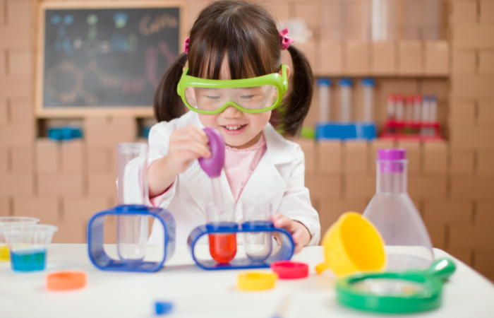 fun things to do with kids girl doing a science experiement
