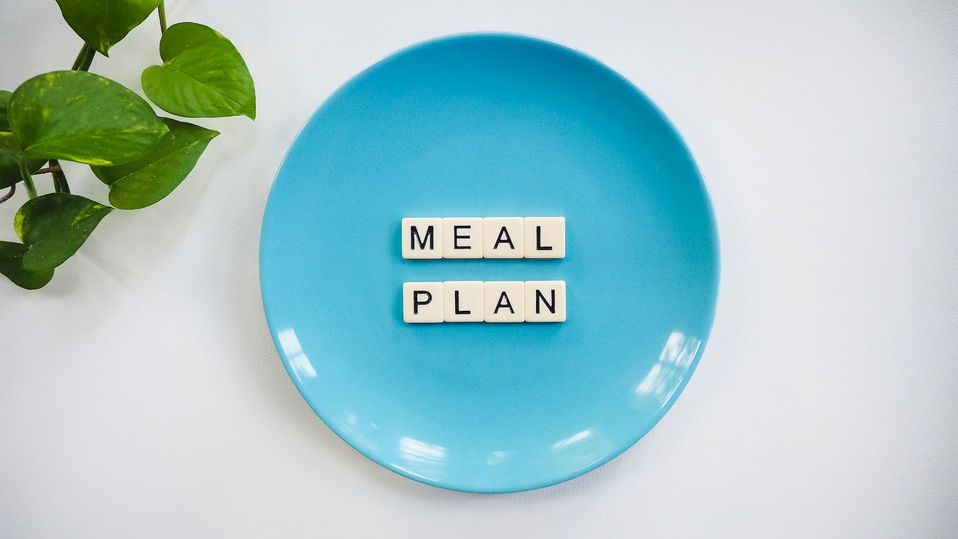 blue ceramic plate with meal plan blocks getting back into a routine after the holidays