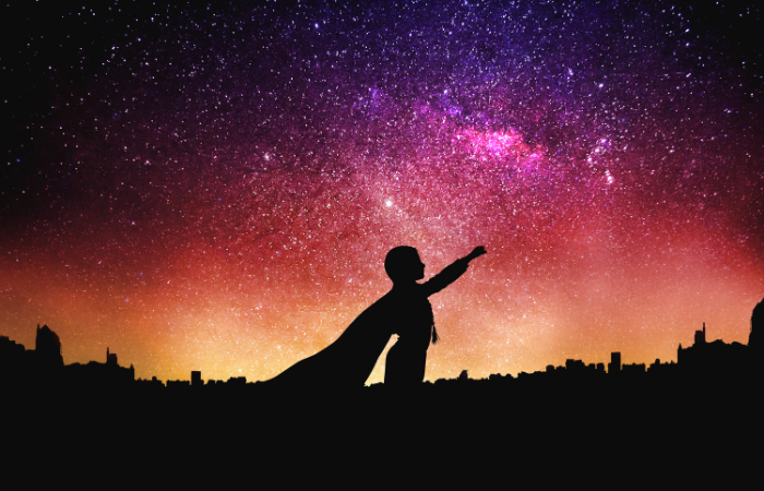 outdoor games night child in a stary night silhouette in a cape