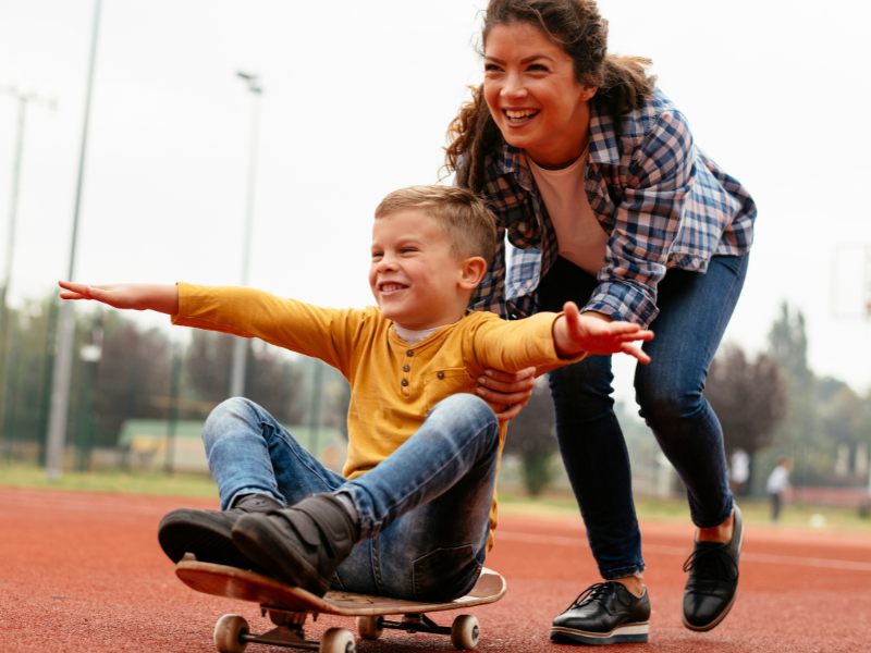 mom and son date ideas mom pushing son on skate board