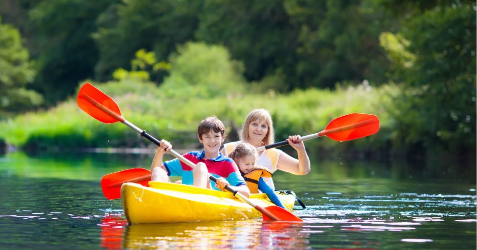 mom and kids in a canoe