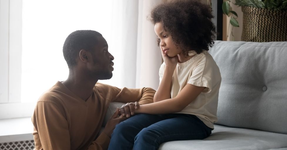 dad talking to daughter