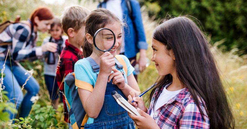 pre teens on an outdoor scavenger hunt