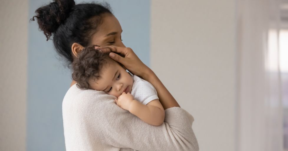 mom holding a child logical consequences example coping mechanisms