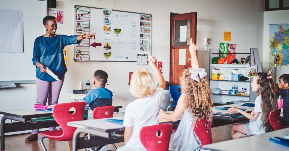 kids and teacher in a classroom environment 