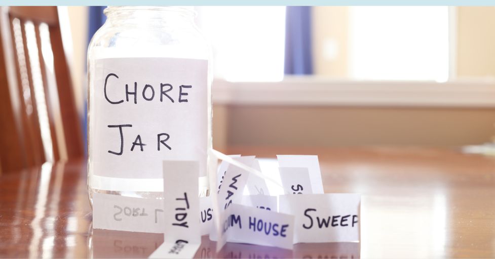 chore jar with chores on various pieces of paper