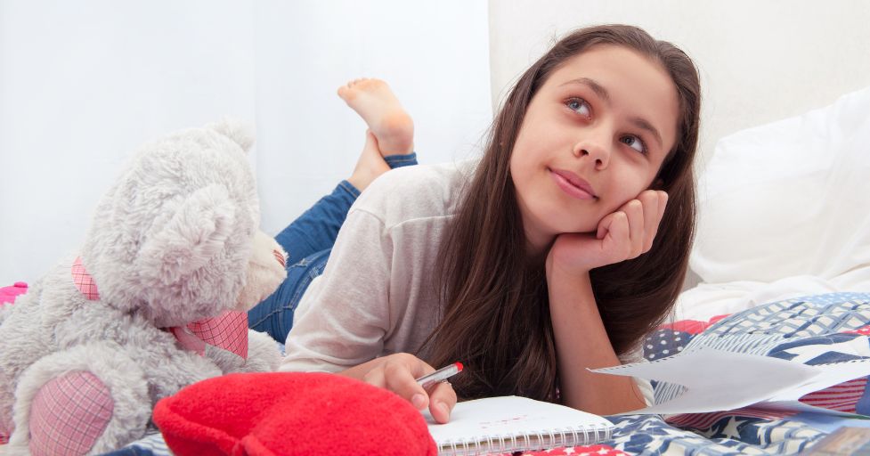 teen girl writing a letter