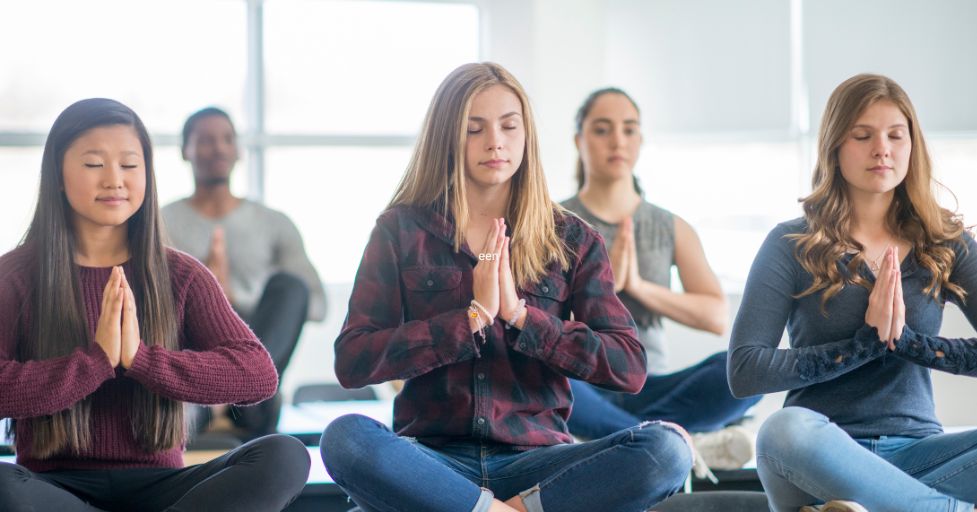 students doing breathing exercises
