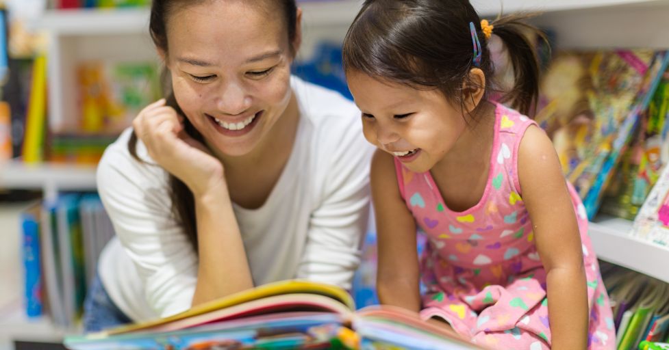 mom and daughter reading a book