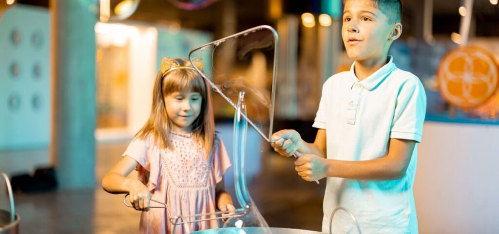 kids doing a science experiment in a museum