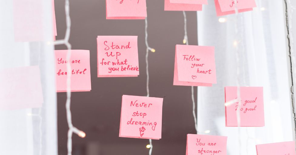 mindfulness quotes for kinds written on post it notes attached to a mirror