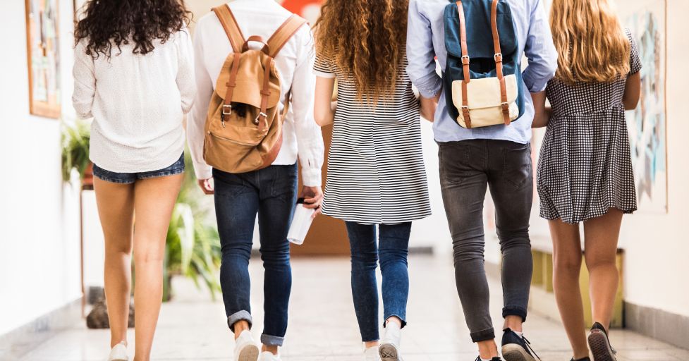 teens walking down the hall 