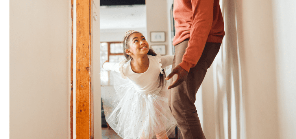 girl in tutu with her dad