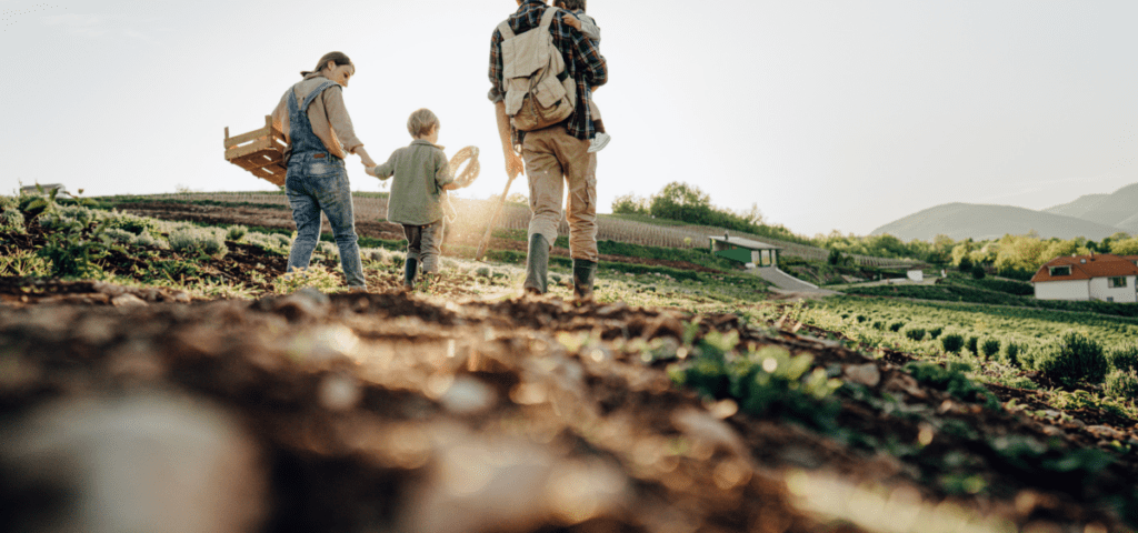 frugal family outings - family walking on a farm