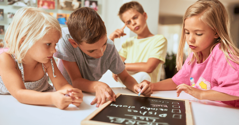 how to create a goal chart for kids kids writing on a handheld chalkboard