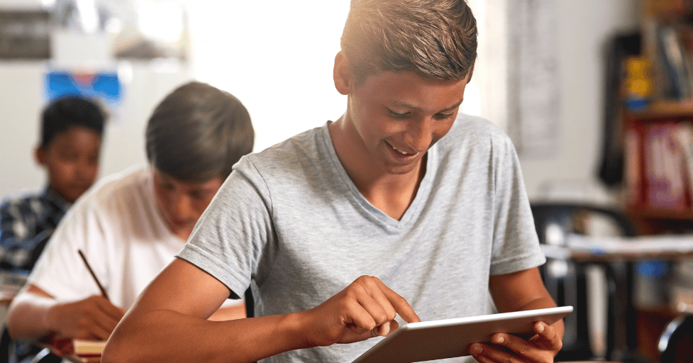 ADHD homework tips young man looking at Ipad